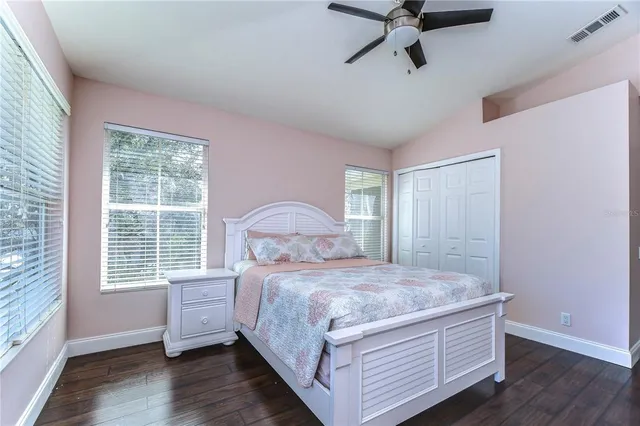a bedroom with a bed and window