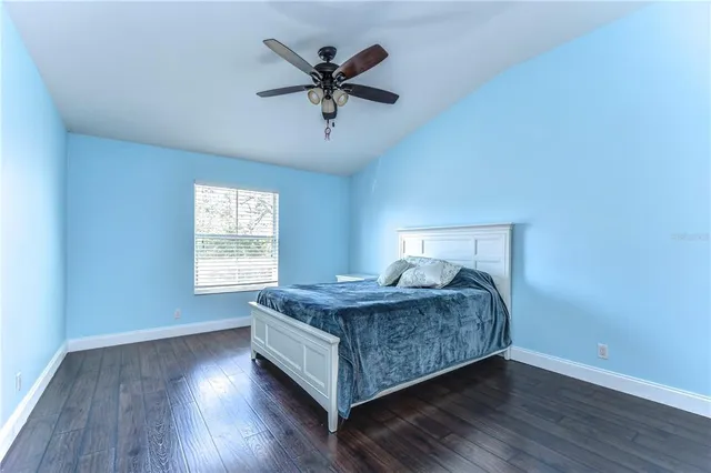 a bedroom with a bed and window