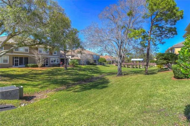 a garden with trees in front of it