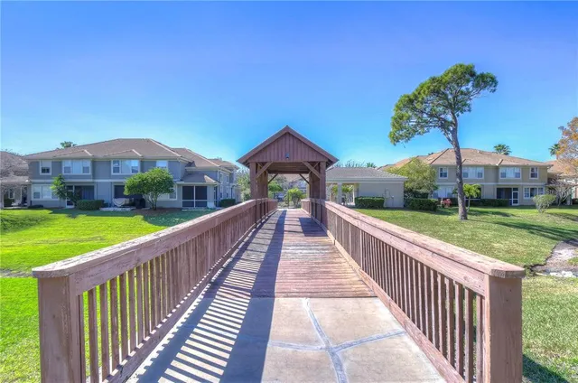 a view of a house with a yard and balcony