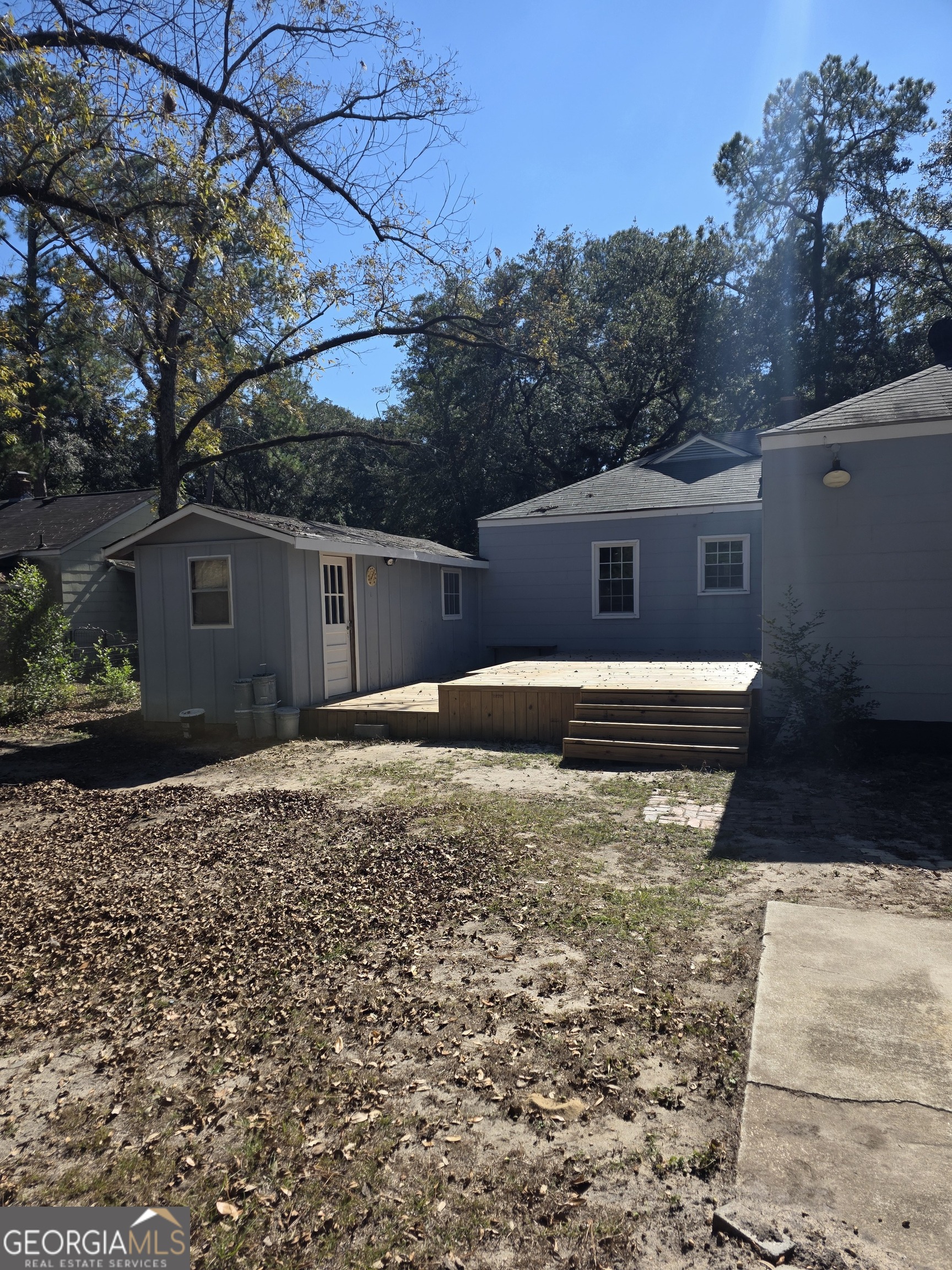 723 10th Avenue Albany, GA 31701 - Photo 22 of 23 a front view of house with yard and trees in the background