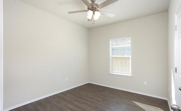 3414 Scott Circle Seguin, TX 78155 - Photo 6 of 12 Empty room featuring dark wood-type flooring and a ceiling fan