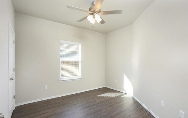 3414 Scott Circle Seguin, TX 78155 - Photo 7 of 12 Unfurnished room featuring dark wood-type flooring and a ceiling fan