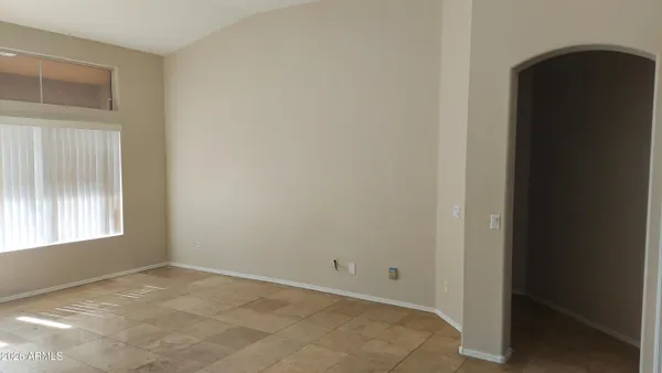 a view of an empty room with a window