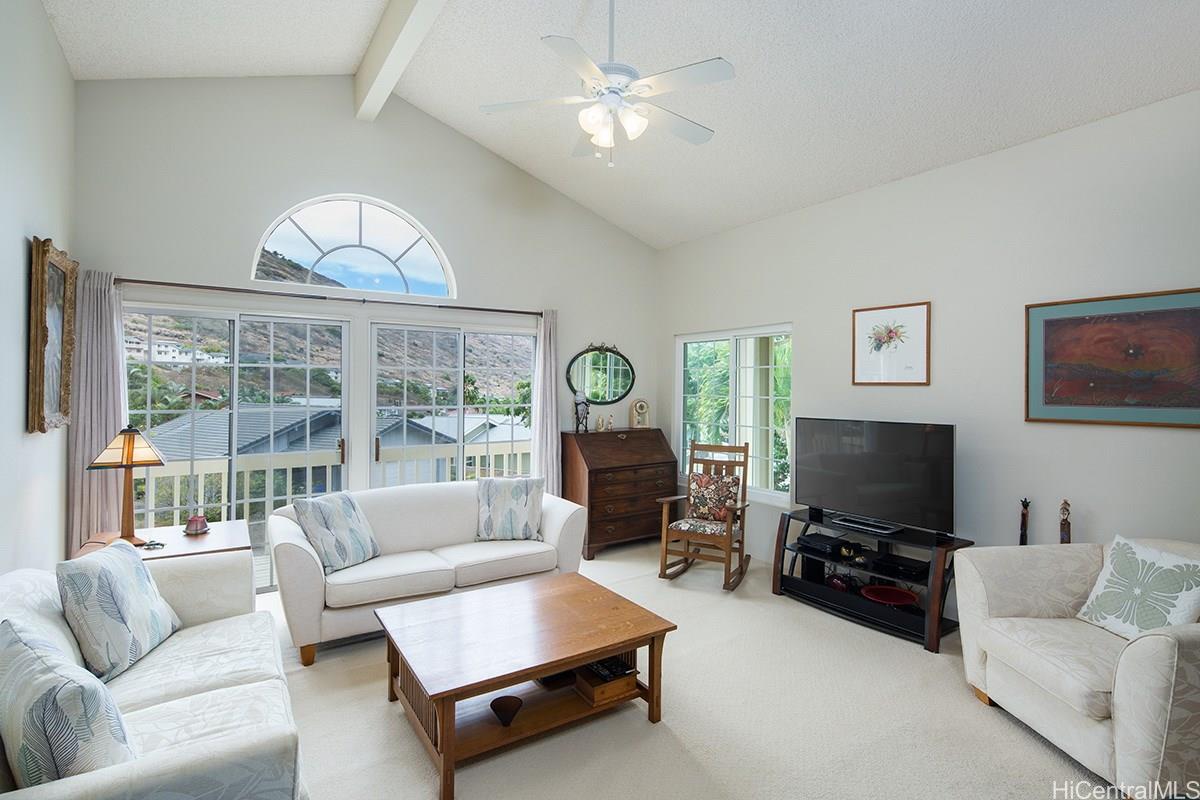 1279 Lunalilo Home Road Honolulu, HI 96825 - Photo 1 of 1 a living room with furniture and a flat screen tv