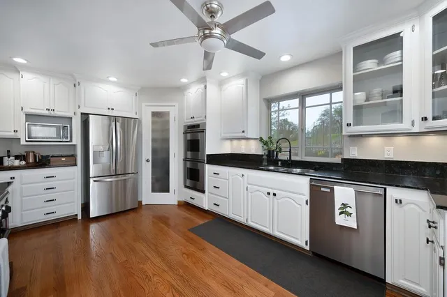 a view of a chairs with wooden floor