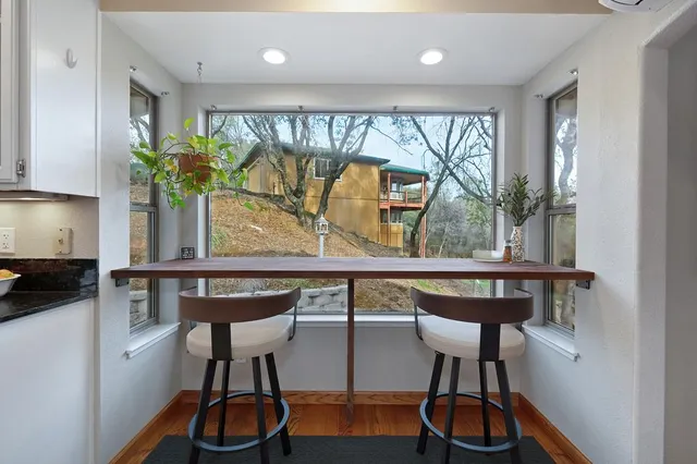 a view of a balcony with wooden floor