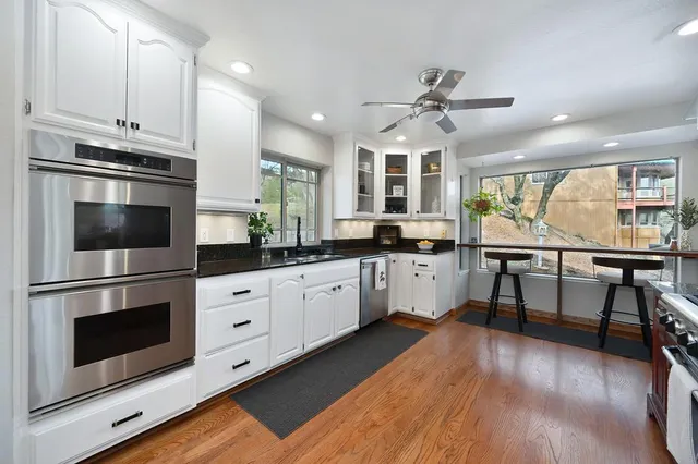 a view of a house with backyard and porch