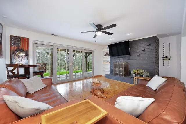 a view of dirt yard with a large tree