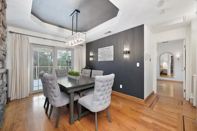a living room with furniture and view of kitchen