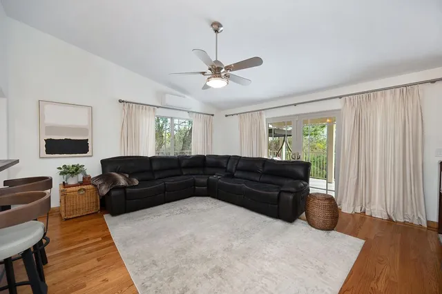 a bedroom with a bed dresser and a window