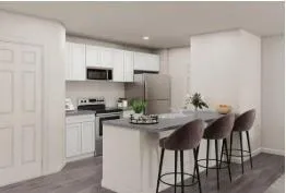 a kitchen with stainless steel appliances kitchen island granite countertop a kitchen island and chairs in it