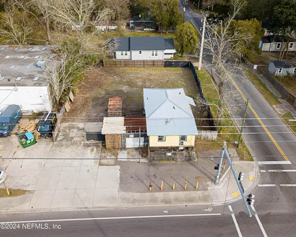an aerial view of a house with swimming pool