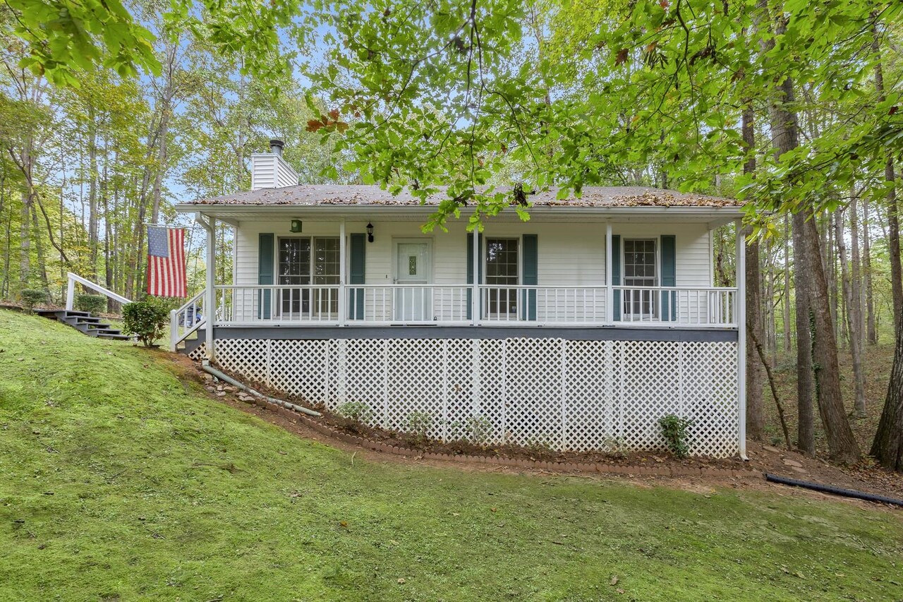 848 Macedonia Road Newnan, GA 30263 - Photo 1 of 1 a front view of a house with a garden