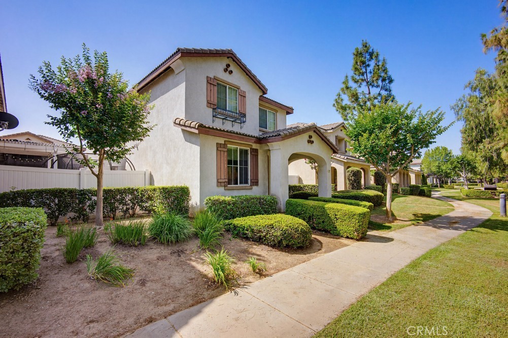 1747 Palermo Drive Riverside, CA 92507 - Photo 4 of 30 a front view of a house with a yard and potted plants