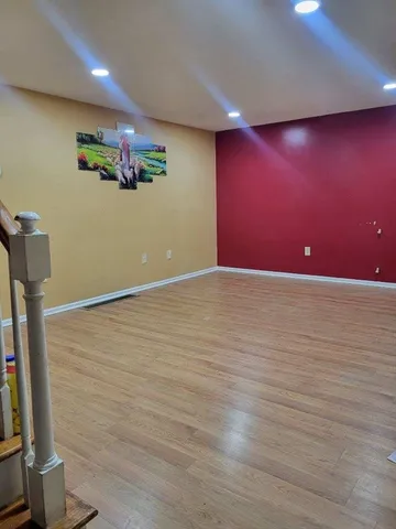 a view of a livingroom with wooden floor