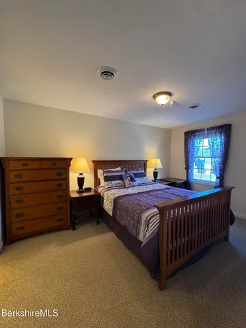 a bathroom with a sink double vanity and a mirror