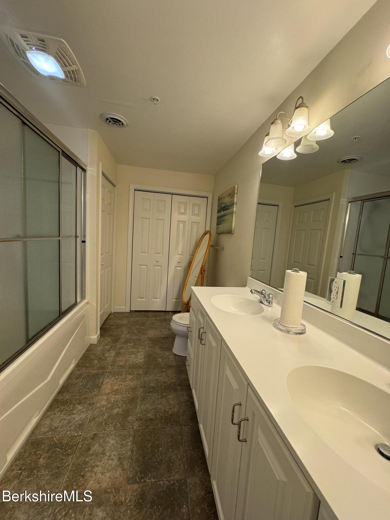 37 Corey Road, Unit 862 Hancock, MA 01237 - Photo 13 of 27 a bathroom with a sink double vanity and a mirror