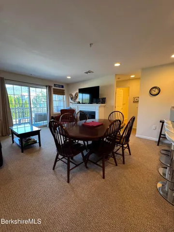 a kitchen with stainless steel appliances kitchen island granite countertop a sink and cabinets