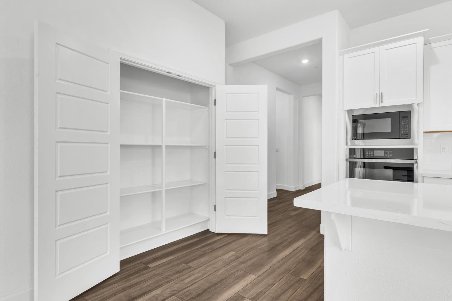 4236 Bellwether Way Sacramento, CA 95835 - Photo 16 of 46 a view of walk in closet with empty racks