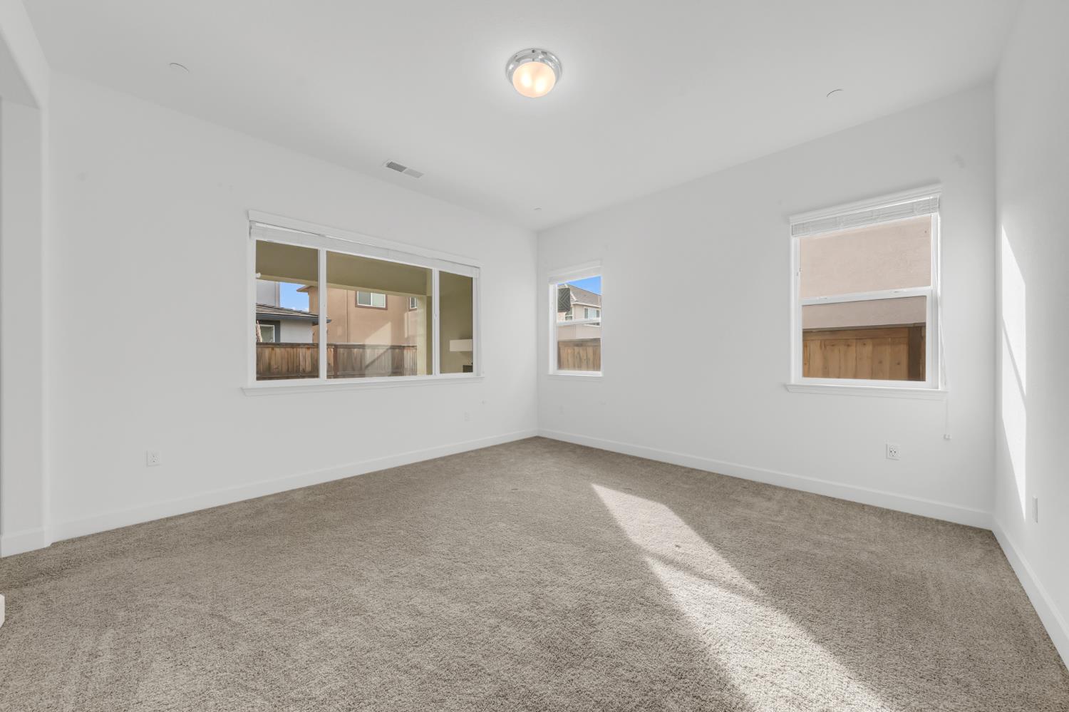 4236 Bellwether Way Sacramento, CA 95835 - Photo 18 of 46 an empty room with windows