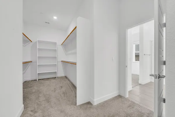 a view of an empty room with a closet