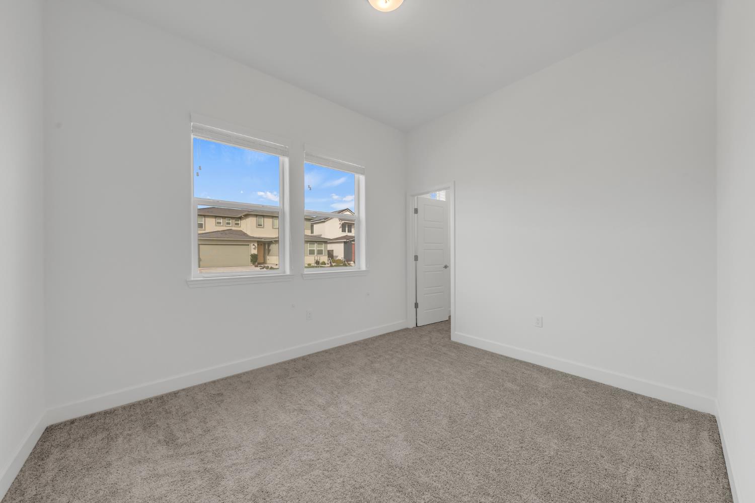 4236 Bellwether Way Sacramento, CA 95835 - Photo 25 of 46 an empty room with windows
