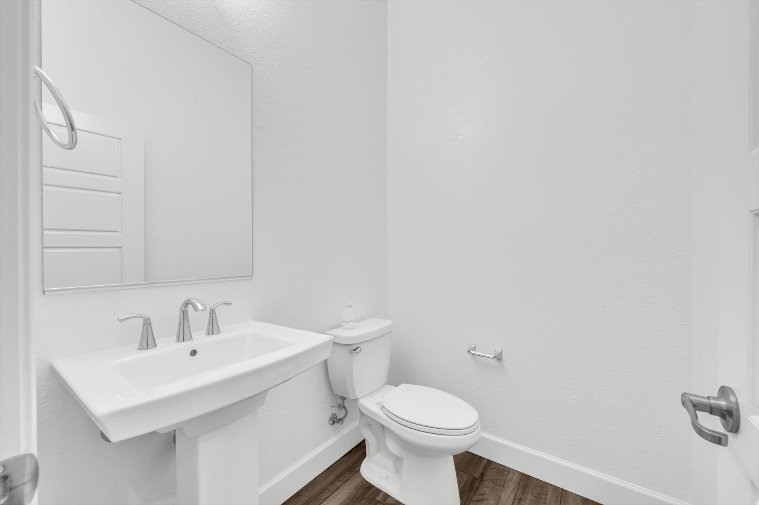 4236 Bellwether Way Sacramento, CA 95835 - Photo 34 of 46 a bathroom with a sink a toilet and mirror