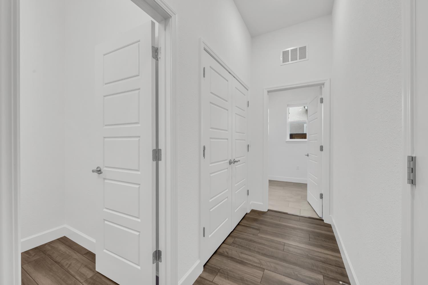 4236 Bellwether Way Sacramento, CA 95835 - Photo 35 of 46 a view of a hallway with wooden floor