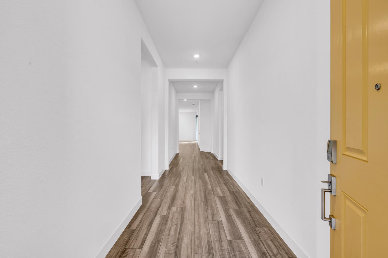 4236 Bellwether Way Sacramento, CA 95835 - Photo 4 of 46 a view of a hallway with wooden floor
