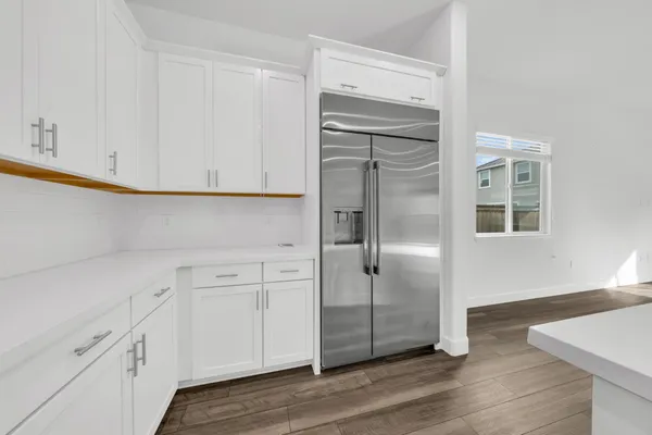 a view of cabinets and wooden floor
