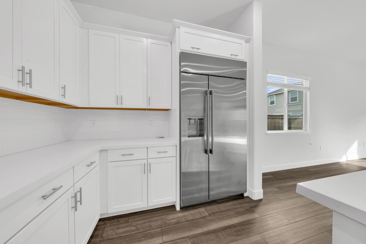 4236 Bellwether Way Sacramento, CA 95835 - Photo 10 of 46 a view of cabinets and wooden floor