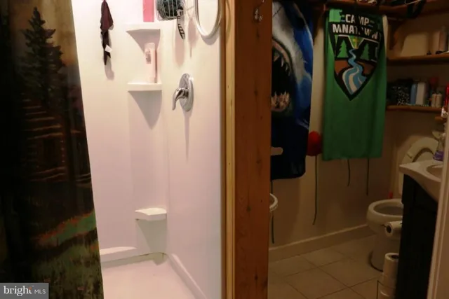 a bathroom with a sink vanity and a mirror