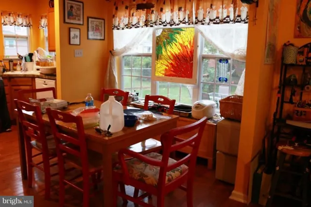 a living room with furniture a piano and a fireplace