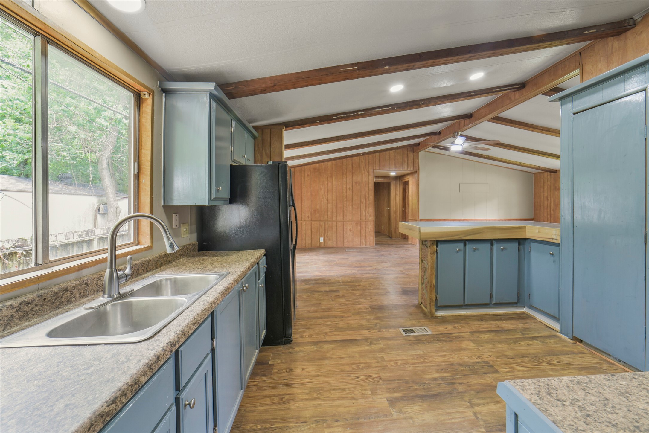 11023 Forrest Valley Drive Houston, TX 77065 - Photo 21 of 47 a kitchen with a sink cabinets and wooden floor
