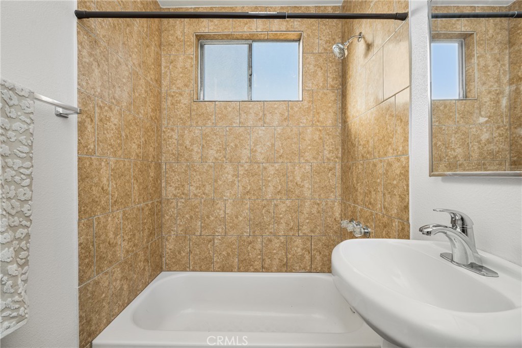 6725 Perry Road Bell Gardens, CA 90201 - Photo 30 of 40 a bathroom with a white bath tub
