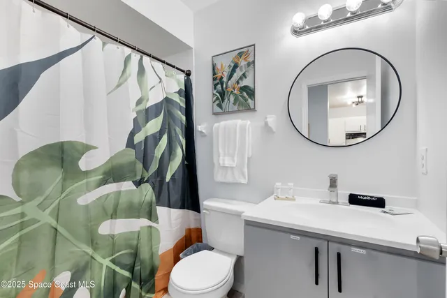 a balcony with table and chairs