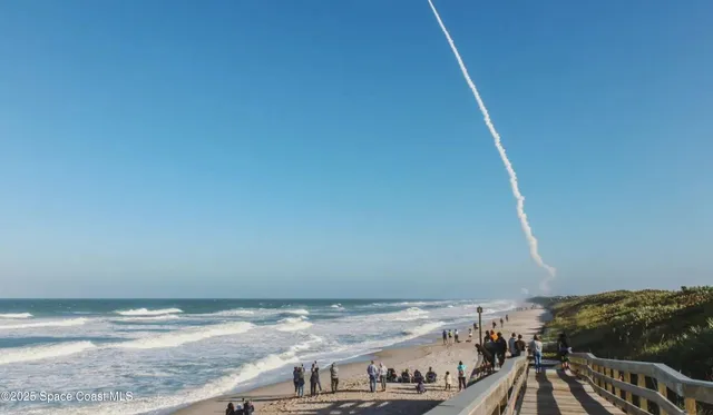 a view of roof deck with two chairs and wooden floor