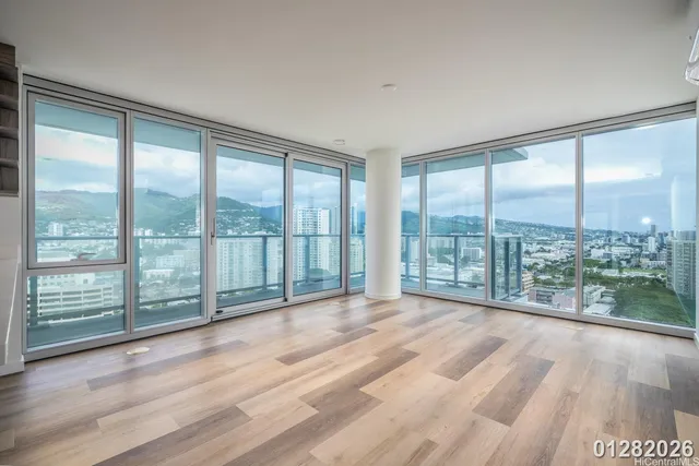 a view of a room with kitchen natural and large window