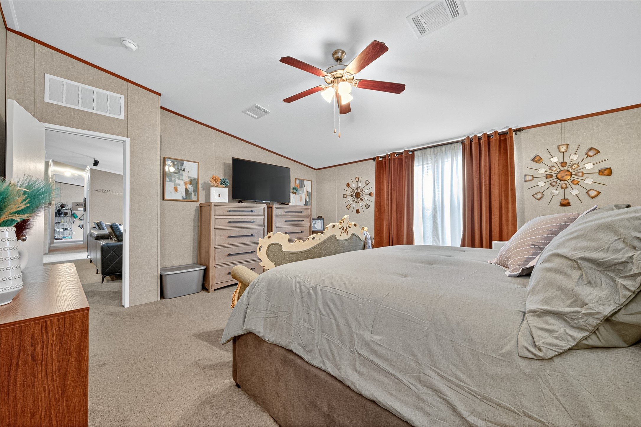 10715 Bozeman Ferry Road Midway, TX 75852 - Photo 19 of 50 a bedroom with a bed and a large mirror with a flat tv screen