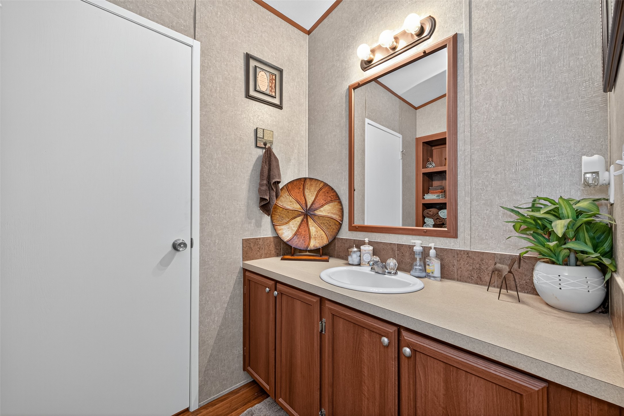 10715 Bozeman Ferry Road Midway, TX 75852 - Photo 30 of 50 a bathroom with a sink and a mirror