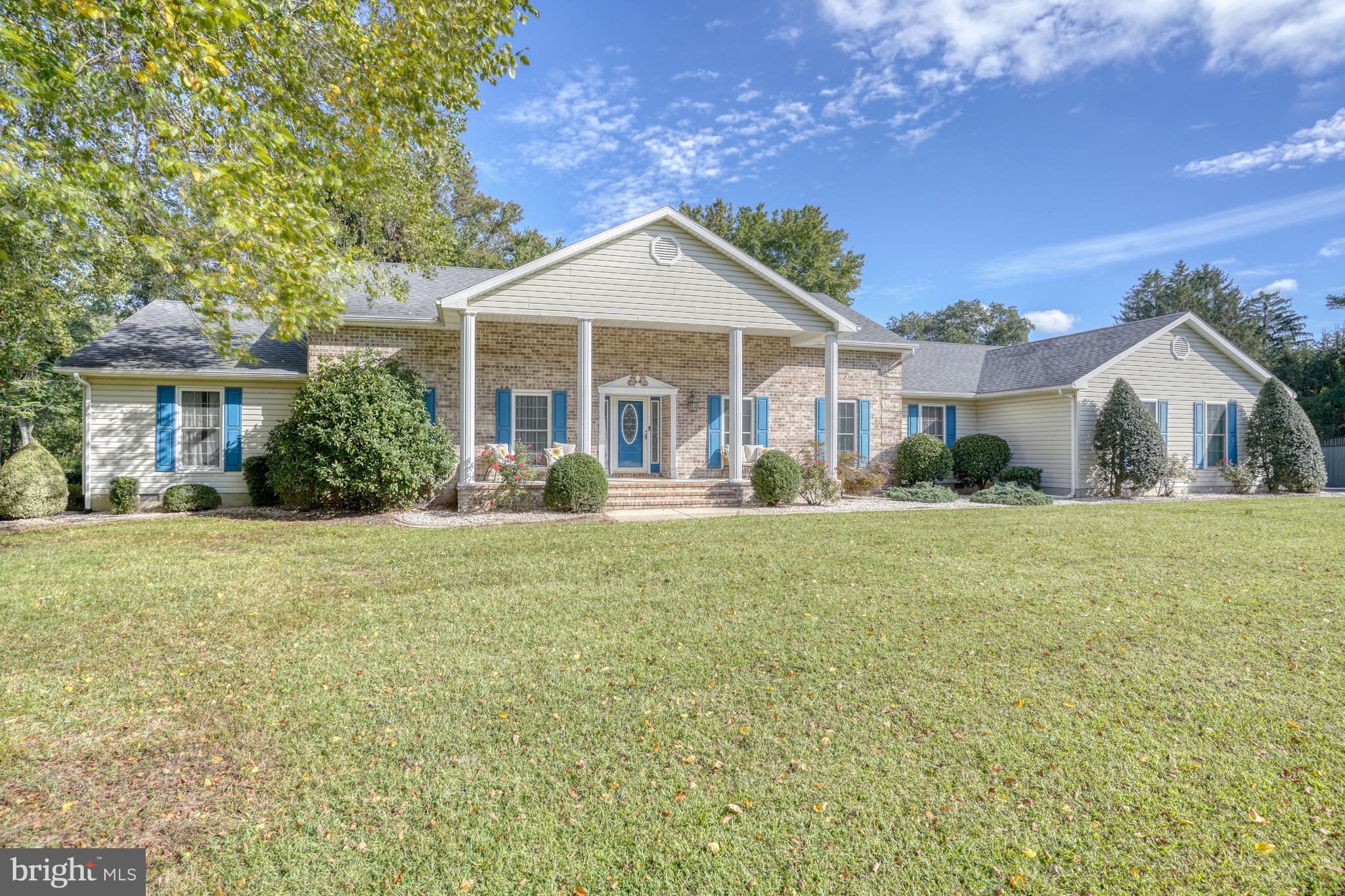 1051 Hartly Road Hartly, DE 19953 - Photo 1 of 47 a front view of a house with a garden