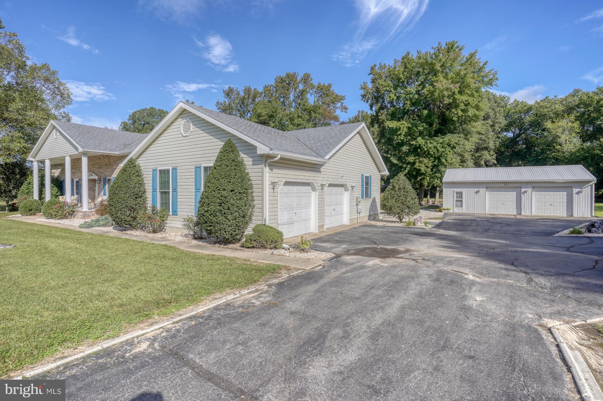 1051 Hartly Road Hartly, DE 19953 - Photo 17 of 47 front view of a house and a yard