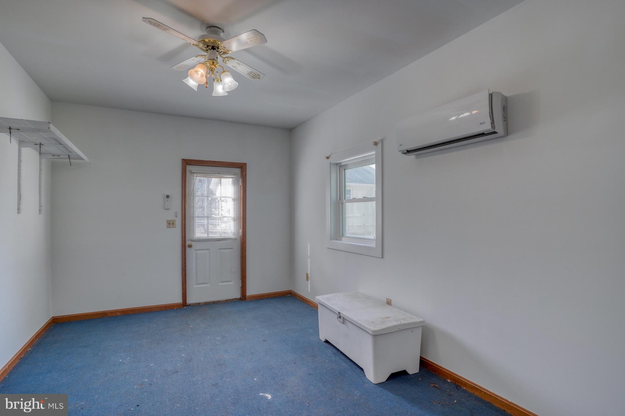 1051 Hartly Road Hartly, DE 19953 - Photo 27 of 47 a living room with furniture and a ceiling fan