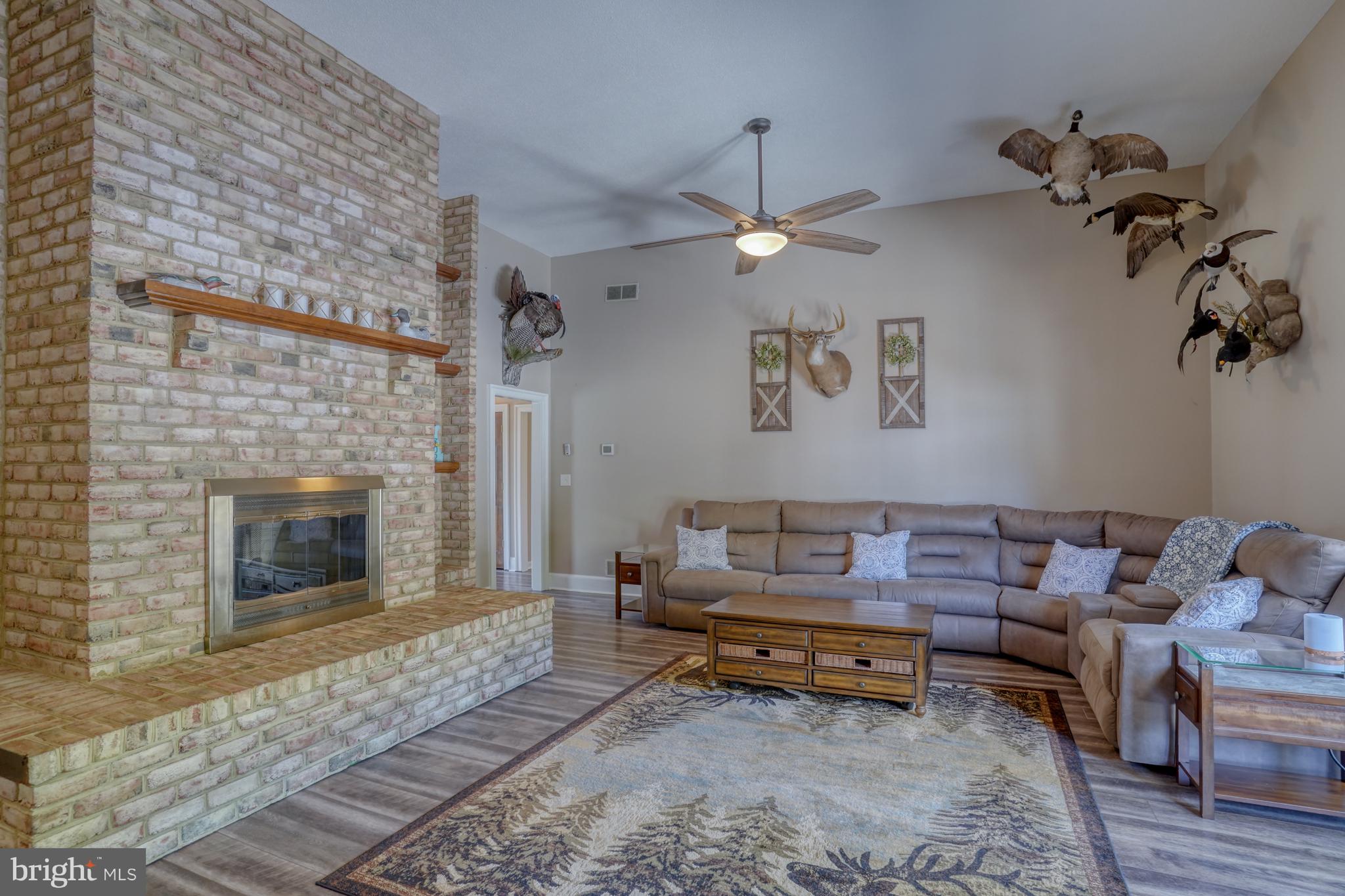 1051 Hartly Road Hartly, DE 19953 - Photo 31 of 47 a living room with furniture and a fireplace