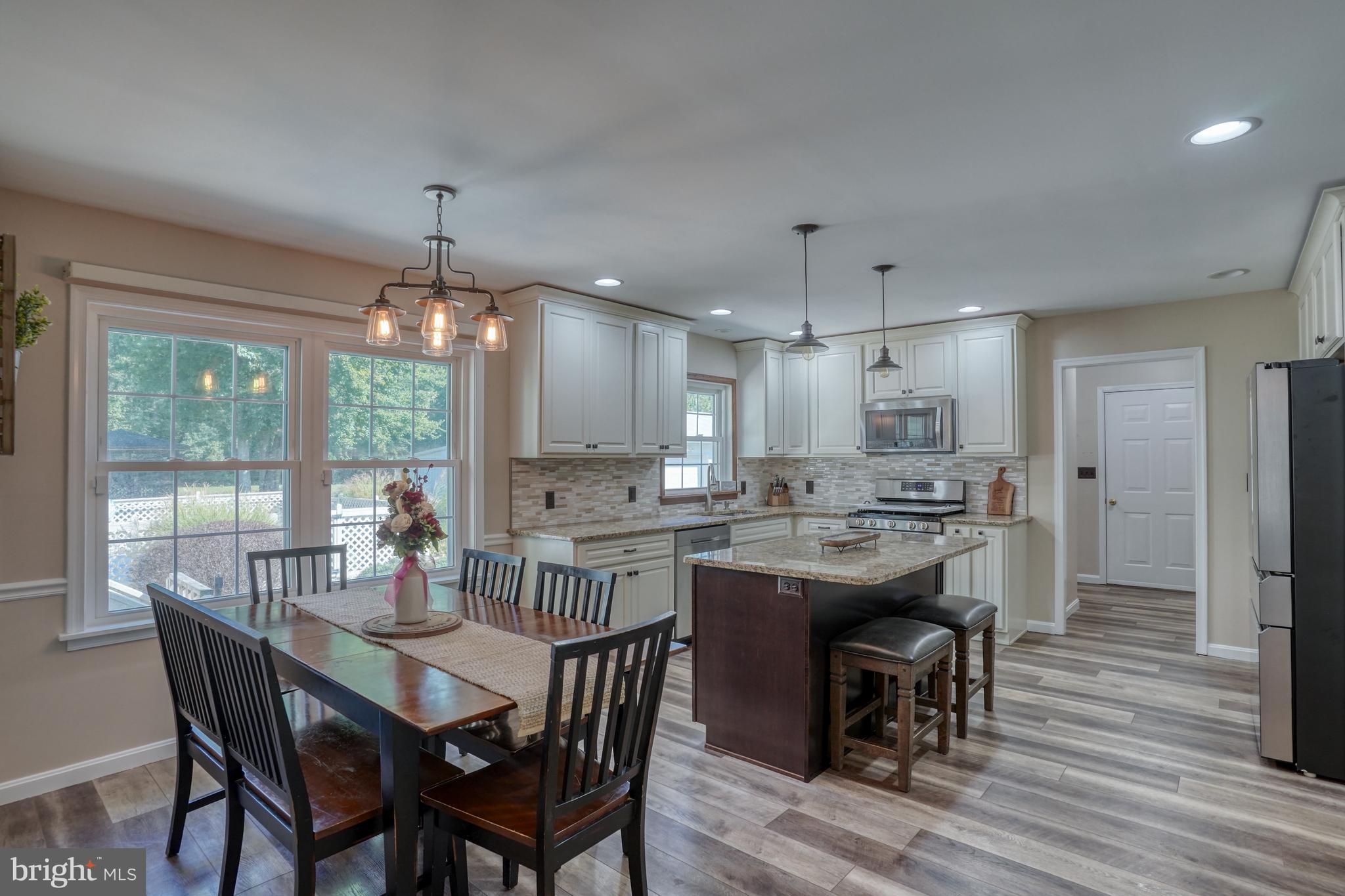 1051 Hartly Road Hartly, DE 19953 - Photo 32 of 47 a view of a dining room with furniture window and wooden floor