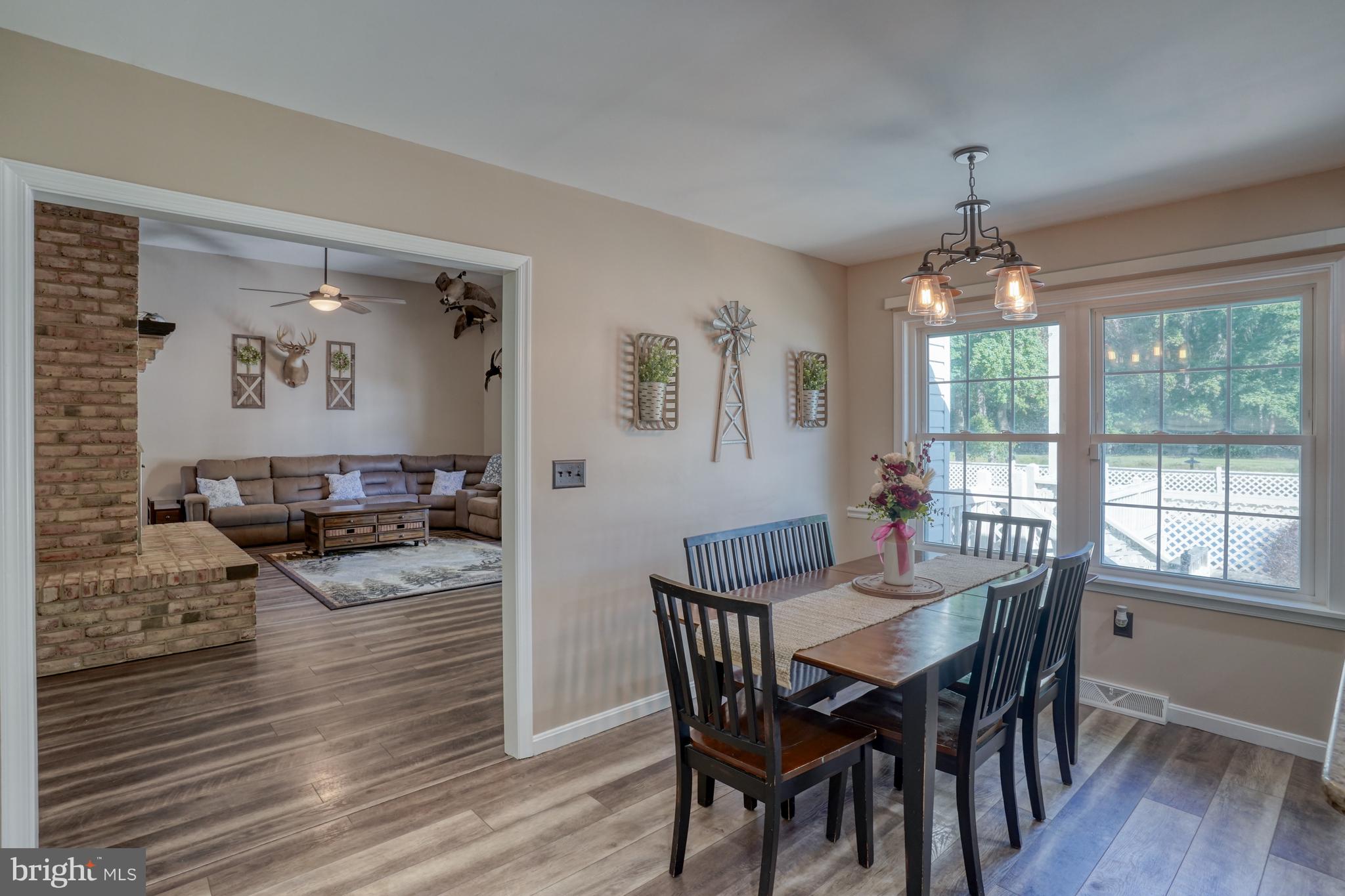 1051 Hartly Road Hartly, DE 19953 - Photo 33 of 47 a view of a dining room with furniture window and wooden floor