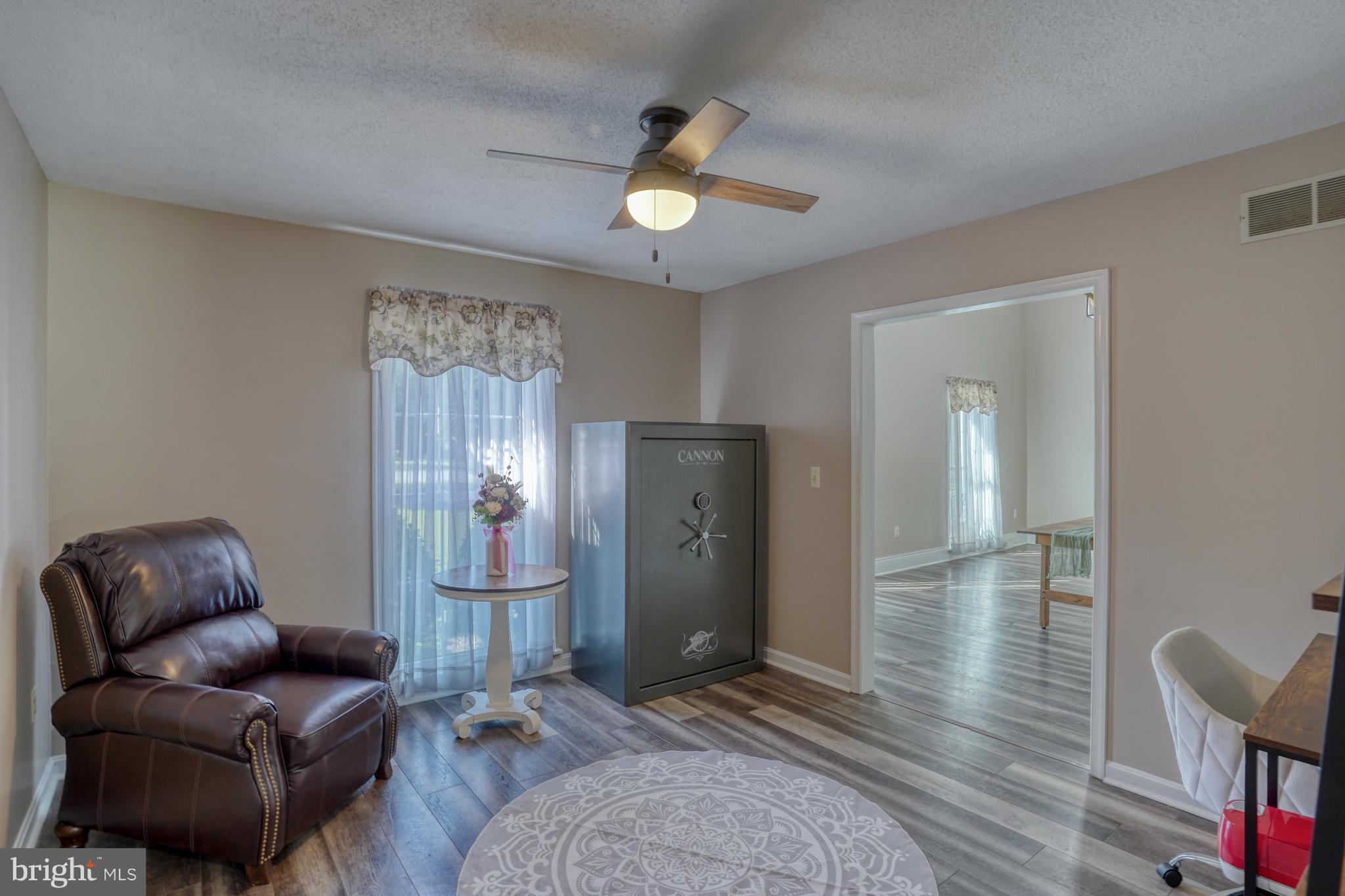 1051 Hartly Road Hartly, DE 19953 - Photo 38 of 47 a living room with furniture and a chandelier