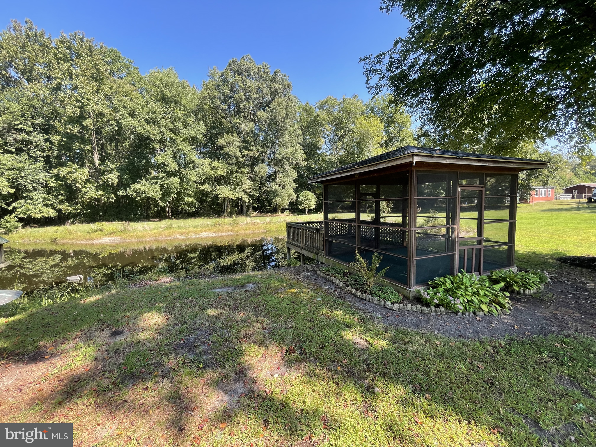 1051 Hartly Road Hartly, DE 19953 - Photo 10 of 47 a view of a backyard with wooden fence and floor