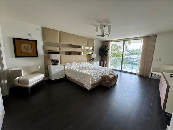 a bedroom with a bed and a couch